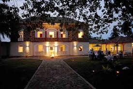 Twilight outdoor dining at Roça Belo Monte, a luxury choice among Sao Tome roca hotels.